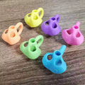 Set of soft silicone pencil grips for easier writing